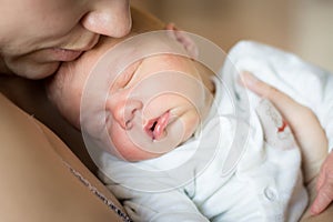 Woman holding newborn baby boy