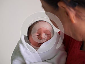 Woman holding newborn child
