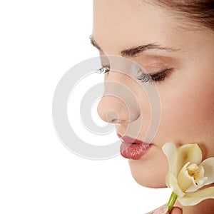 Woman holding orchid flower