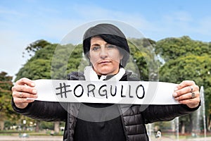 Woman holding an  orgullo or  pride sign. photo