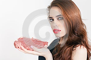 Woman holding packaged meat at the supermarket