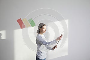 Woman Holding Paint Color Swatches