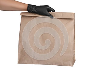 Woman holding paper bag on white background