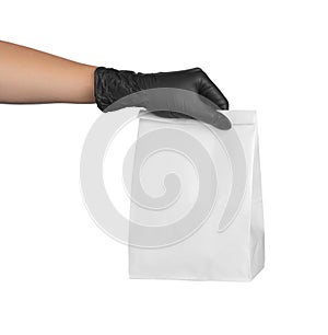 Woman holding paper bag on white, closeup