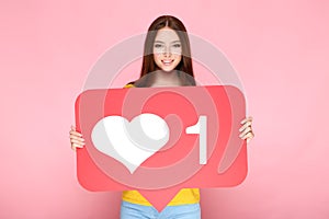 Woman holding paper card with heart