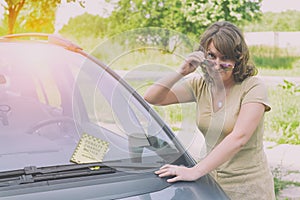 Woman holding parking ticket