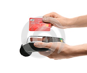 Woman holding payment terminal and credit card on white