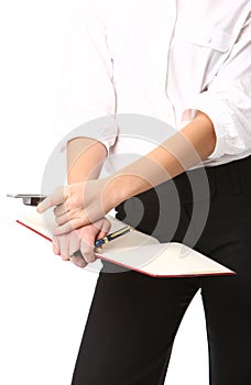 Woman holding a pen and a mobele phone