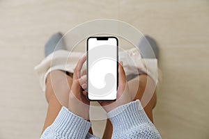 Woman holding a phone while using the toilet, Mock up phone  whi