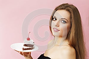 Woman holding a piece of cake