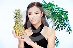 Woman holding pineapple