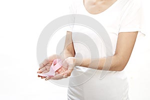 Woman holding a pink ribbon.