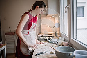 Woman holding the plate with food and smiling