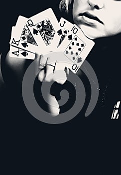 Woman holding playing cards, retro photo.