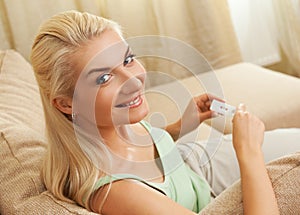 Woman holding positive pregnancy test