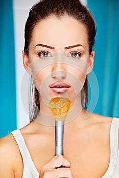 Woman holding powder brush