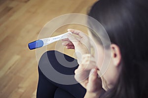 Woman Holding Pregnancy Test