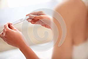 Woman Holding Pregnancy Test. Positive.