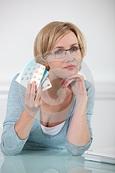 Woman holding prescription drugs