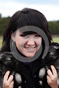 Woman Holding Puppies