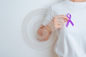 Woman holding purple Ribbon for Violence, Pancreatic, Esophageal, Testicular cancer, Alzheimer, epilepsy, lupus, Sarcoidosis and