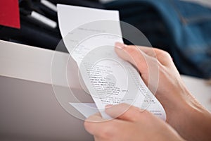 Woman Holding Receipt In Store