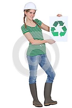 Woman holding recycle logo