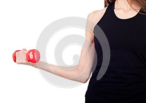 A woman holding a red dumbbell