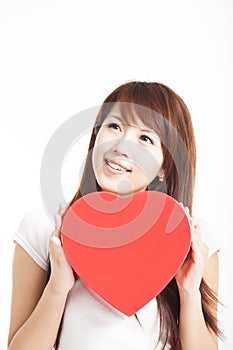Woman holding red heart gift box