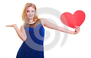 Woman holding red heart love symbol and having blank copy space on her hand. Valentine's Day. Isolated.