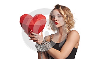 Woman holding red polygonal paper heart shape with tied by chain hands