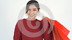 Woman holding red shopping bag
