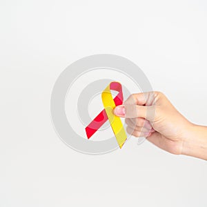 woman holding Red and Yellow ribbon. World hepatitis day awareness month, 28 July, Liver cancer, Jaundice, Cirrhosis, Failure,