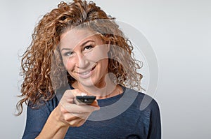 Woman holding a Remote Control