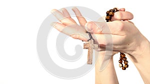 Woman holding a rosary beads cross in her hands