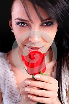 woman holding a rose