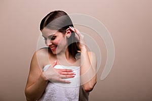 Woman holding a set of bath sponges