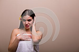 Woman holding a set of bath sponges