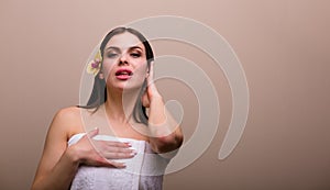 Woman holding a set of bath sponges