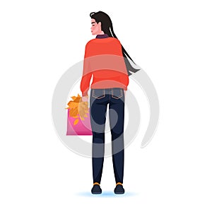 Woman holding shopping bag and autumn leaves black friday big sale promotion concept