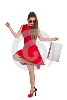 Woman is holding a shopping bag