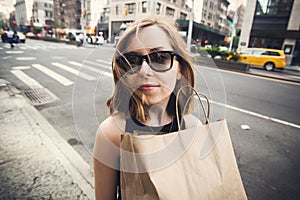 Woman holding shopping bag in Soho, Manhattan, New York