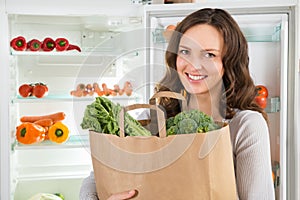 Woman Holding Shopping Bag With Vegetables