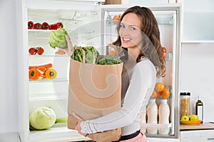 Woman Holding Shopping Bag With Vegetables