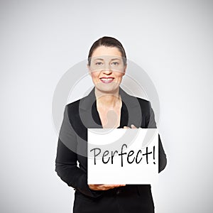 woman holding sign perfect praise