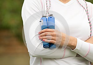 Woman holding skipping rope