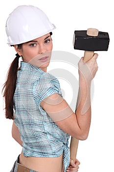 Woman holding sledge-hammer