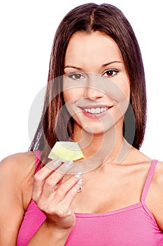 Woman holding slice of melon