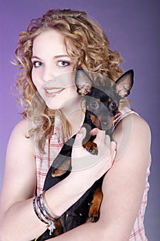 Woman holding a small dog