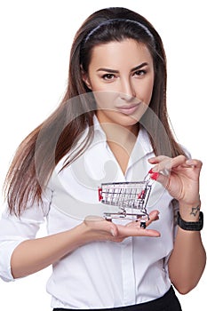 Woman holding small empty shopping cart